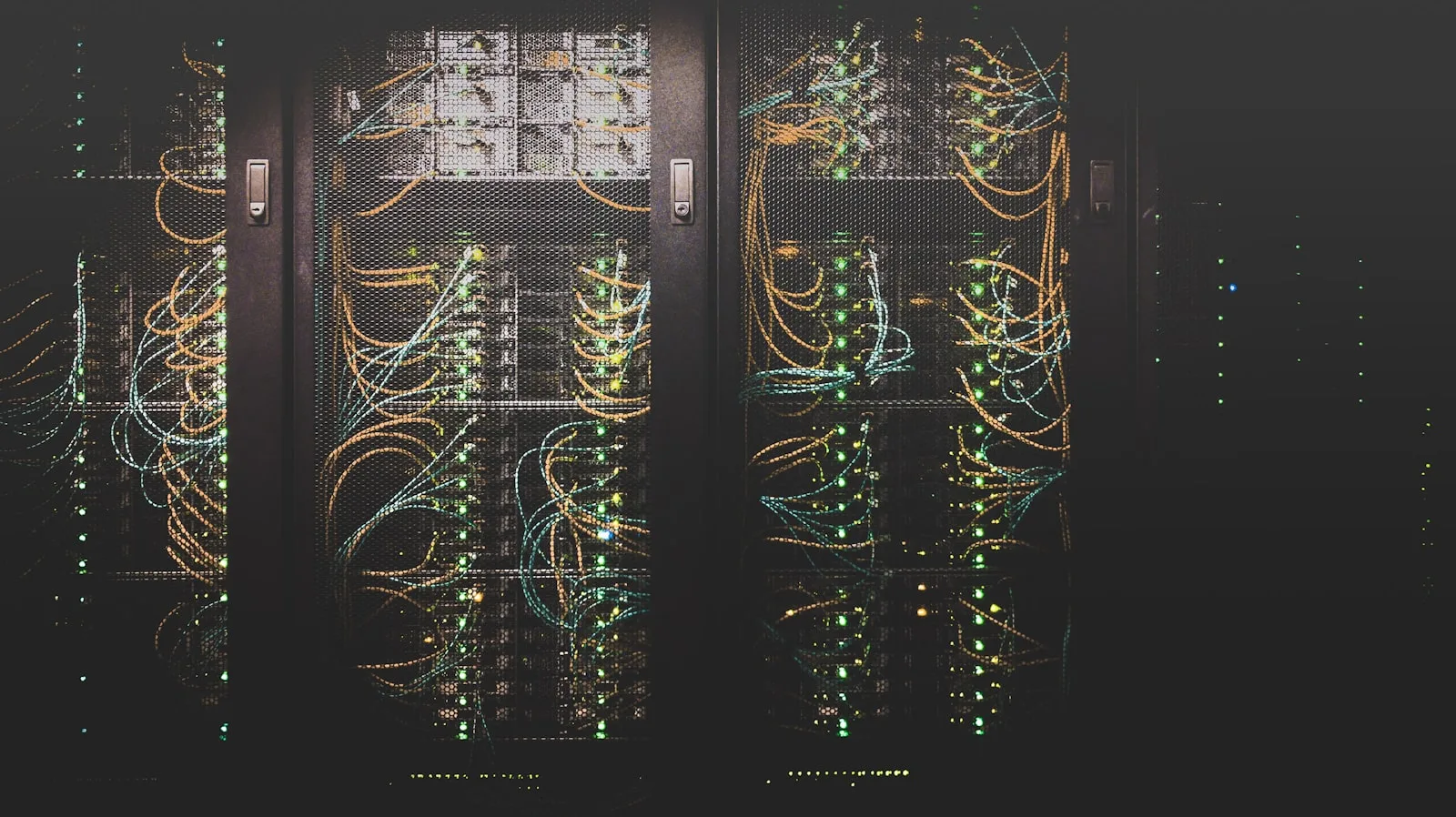 Server racks with illuminated network cabling in a data center